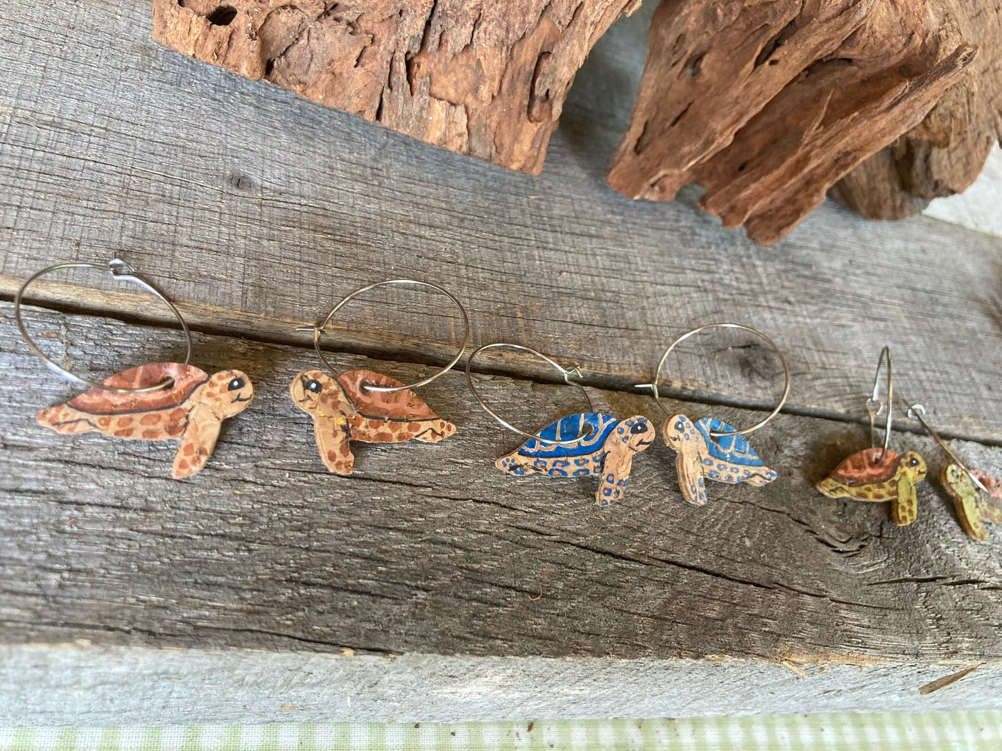 Three pairs of turtle earrings - one blue, one green and one brown