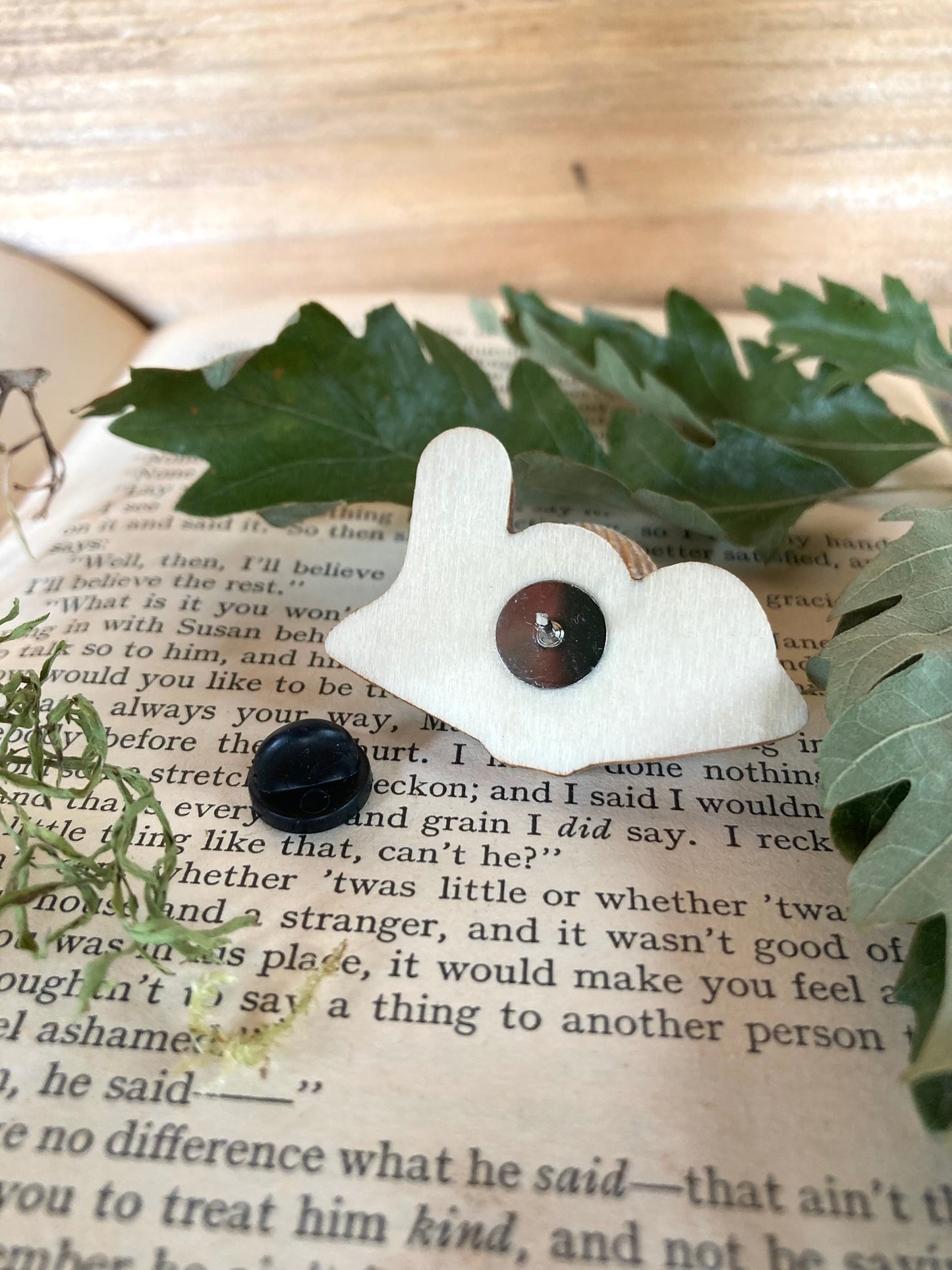 Back of pin badge - made from plywood and secured with a rubber pin back