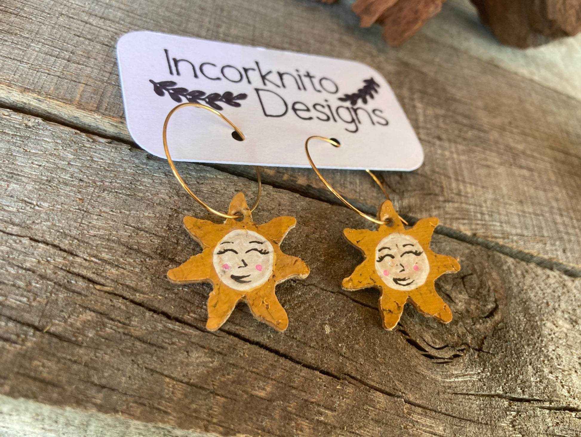 Close up of smiling sun hoop earrings