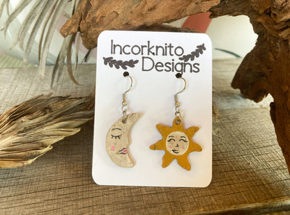 Sun and Moon Earrings crafted with sustainable cork material, these earrings add a touch of eco-chic to your look. The design features a radiant sun on one earring and a crescent moon on the other, symbolizing a perfect balance in style and sustainability.