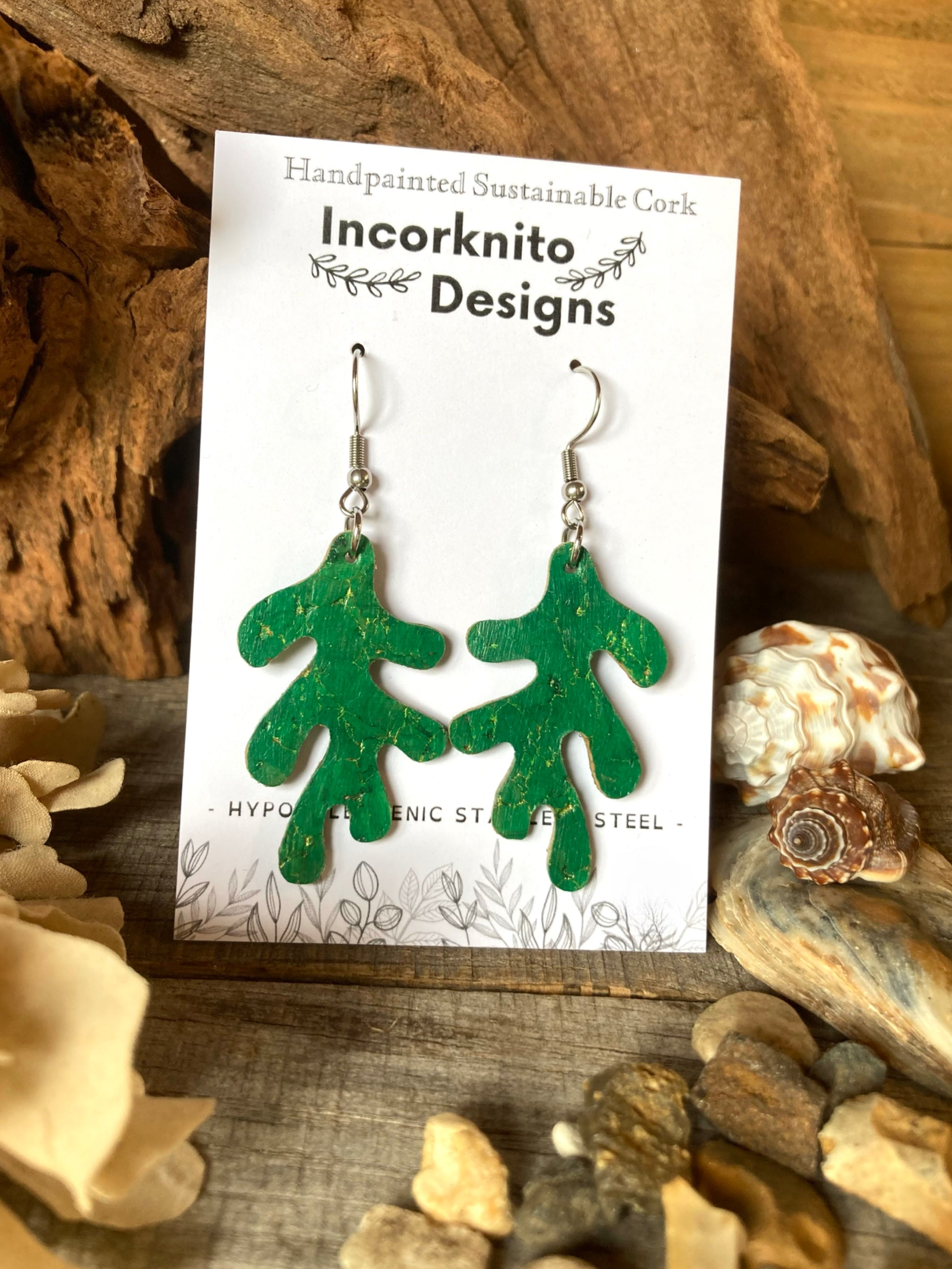 Green cork coral earrings on a 'Incorknito Designs' card with natural background