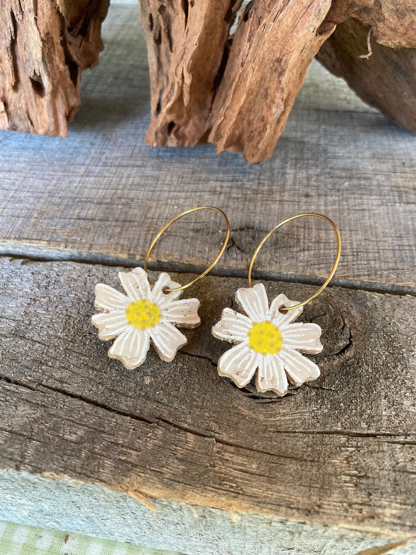 Close up of our handpainted details on our cork daisy earrings