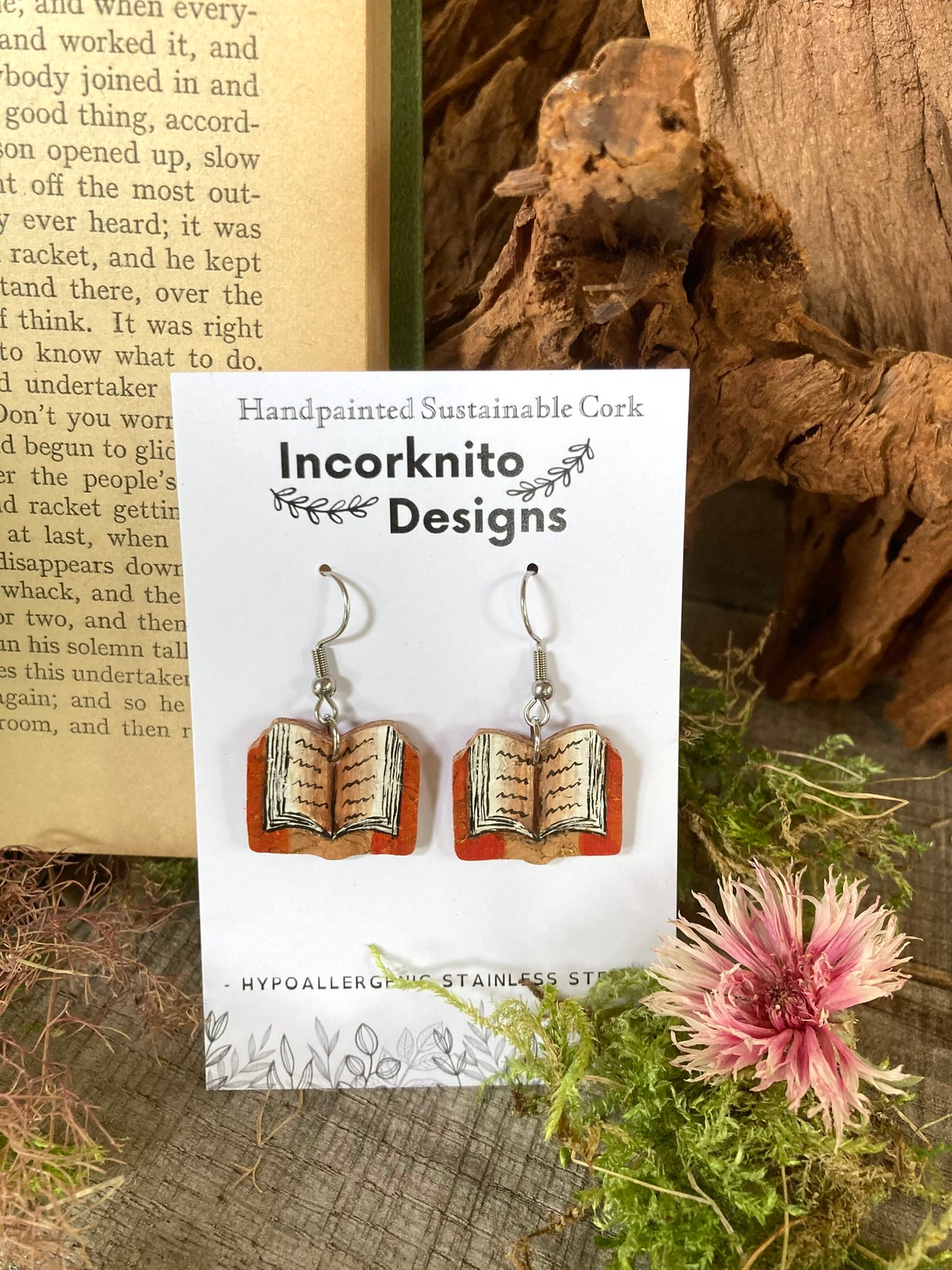Incorknito Designs book cork earrings on a card with natural background