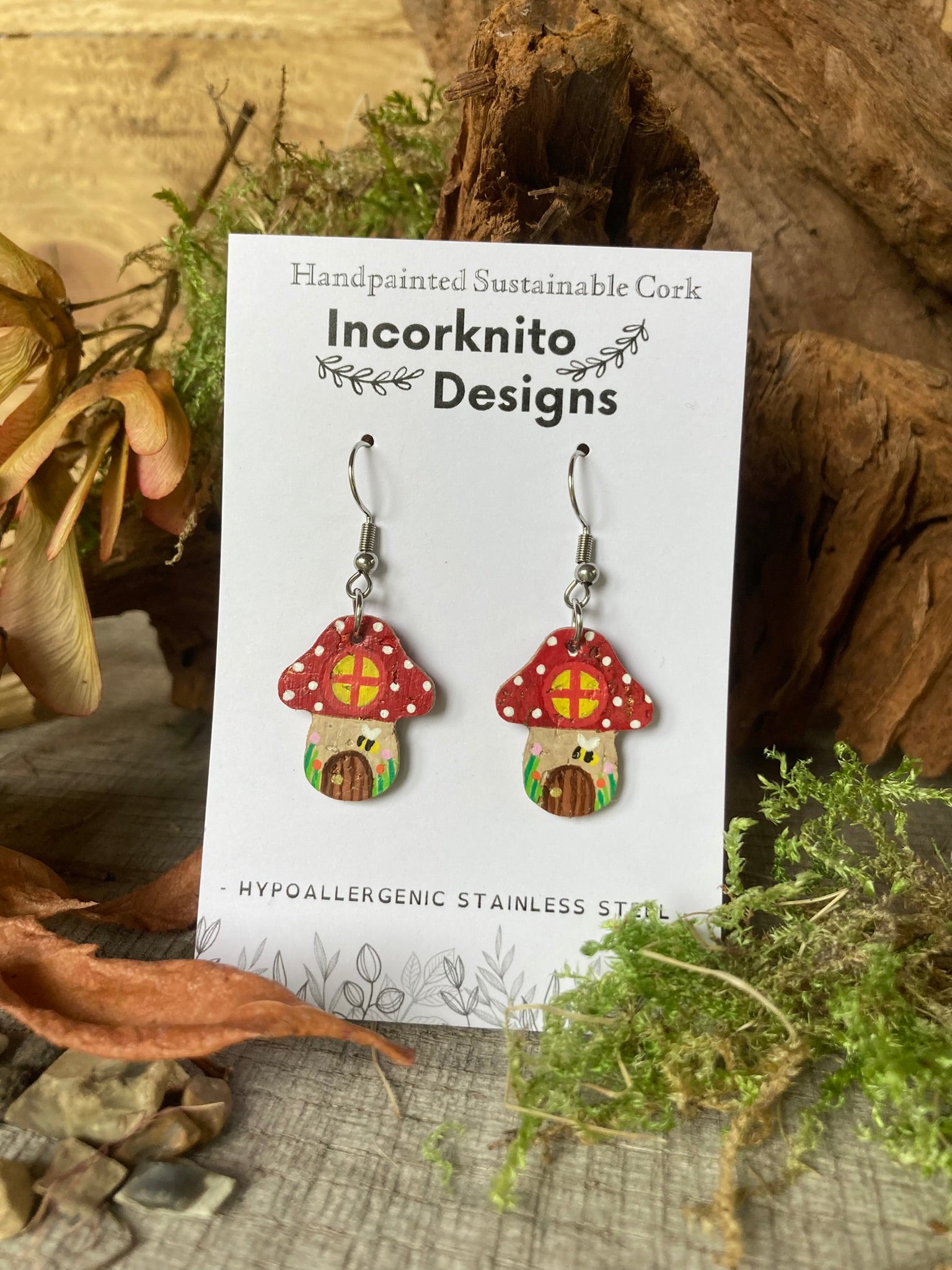Incorknito Designs cork red fairy garden toadstool earrings on a card with natural background