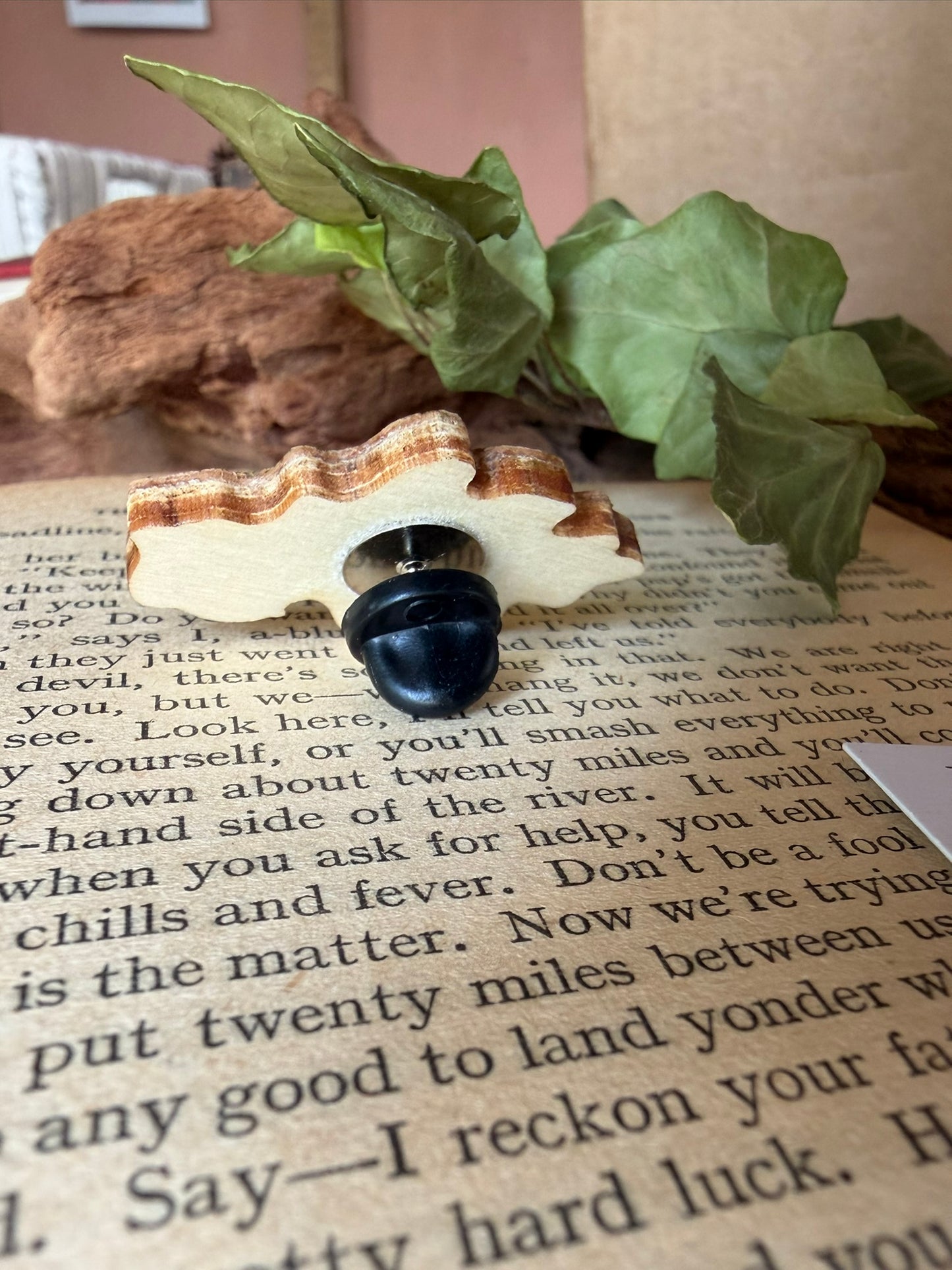Reverse of the acorn and oak leaf cork pin badge showing FSC-certified ply base layers and black rubber butterfly clasp — eco-friendly handmade badge