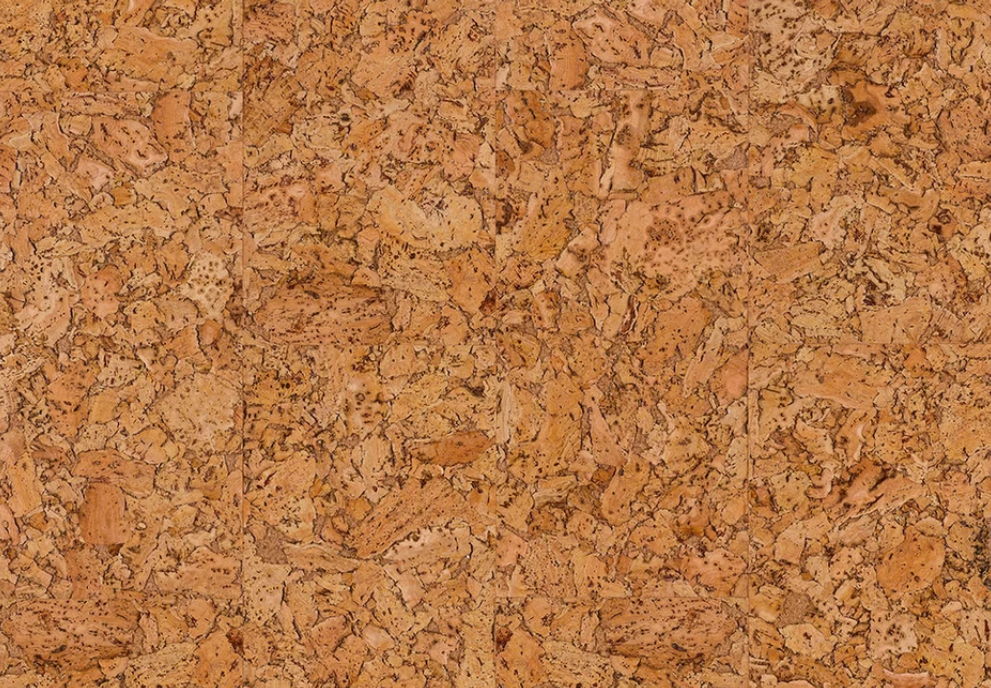 Close-up of natural cork fabric showing its distinctive warm golden-brown texture and grain, used as the base material for Incorknito Designs handmade jewellery.