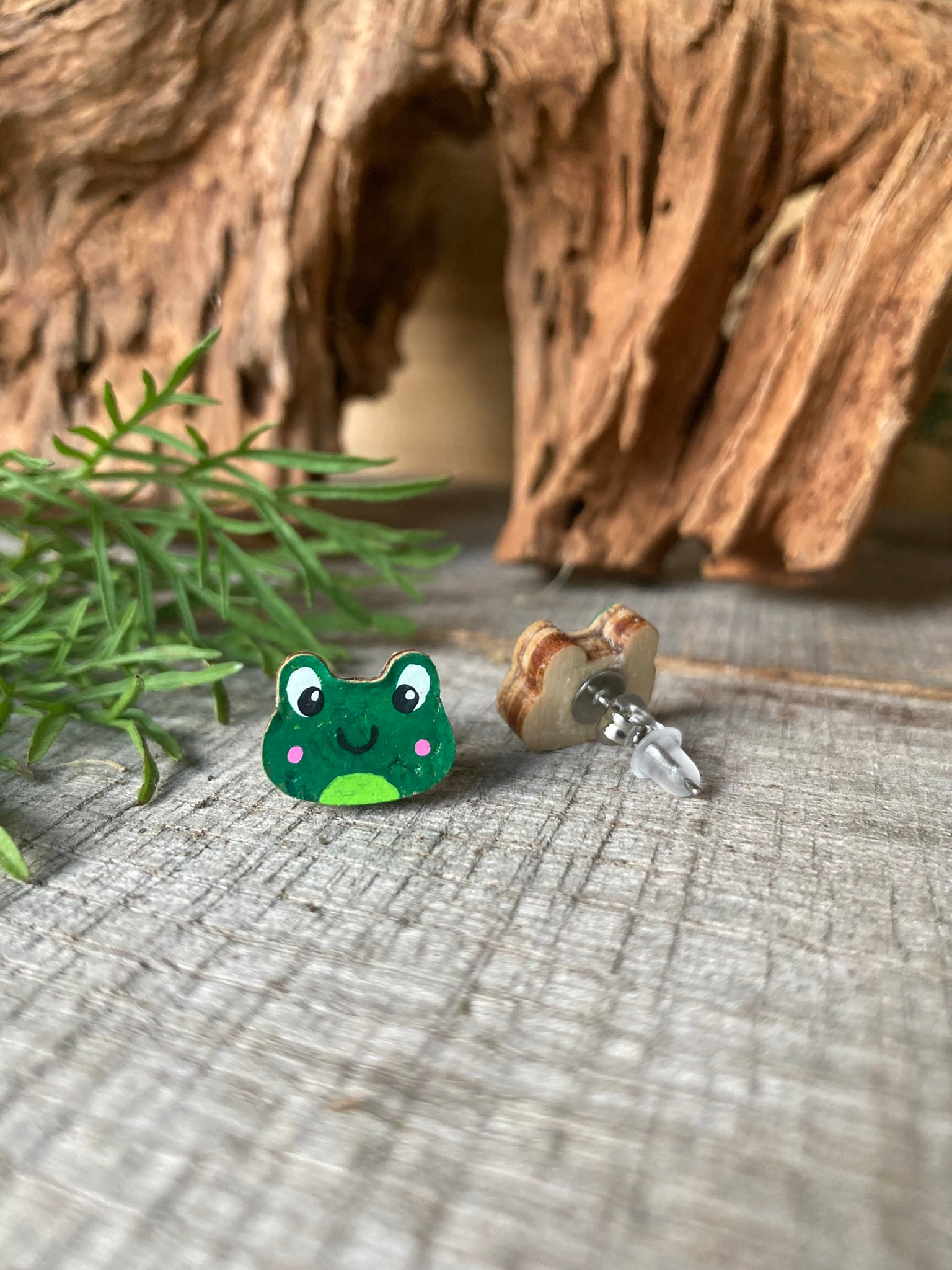 Frog cork stud earring showing front painted face and FSC wood reverse with stainless steel butterfly post