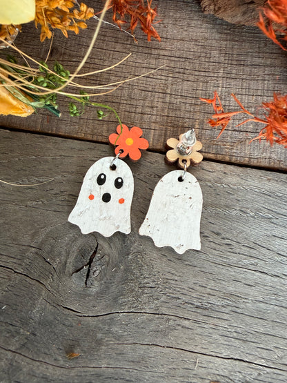 Front and reverse of orange flower ghost earrings, showing the plain white ghost back, wooden flower back and stud fastening.
