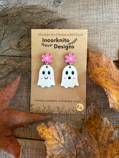 Pink flower stud-top ghost earrings on a kraft display card surrounded by autumn leaves.