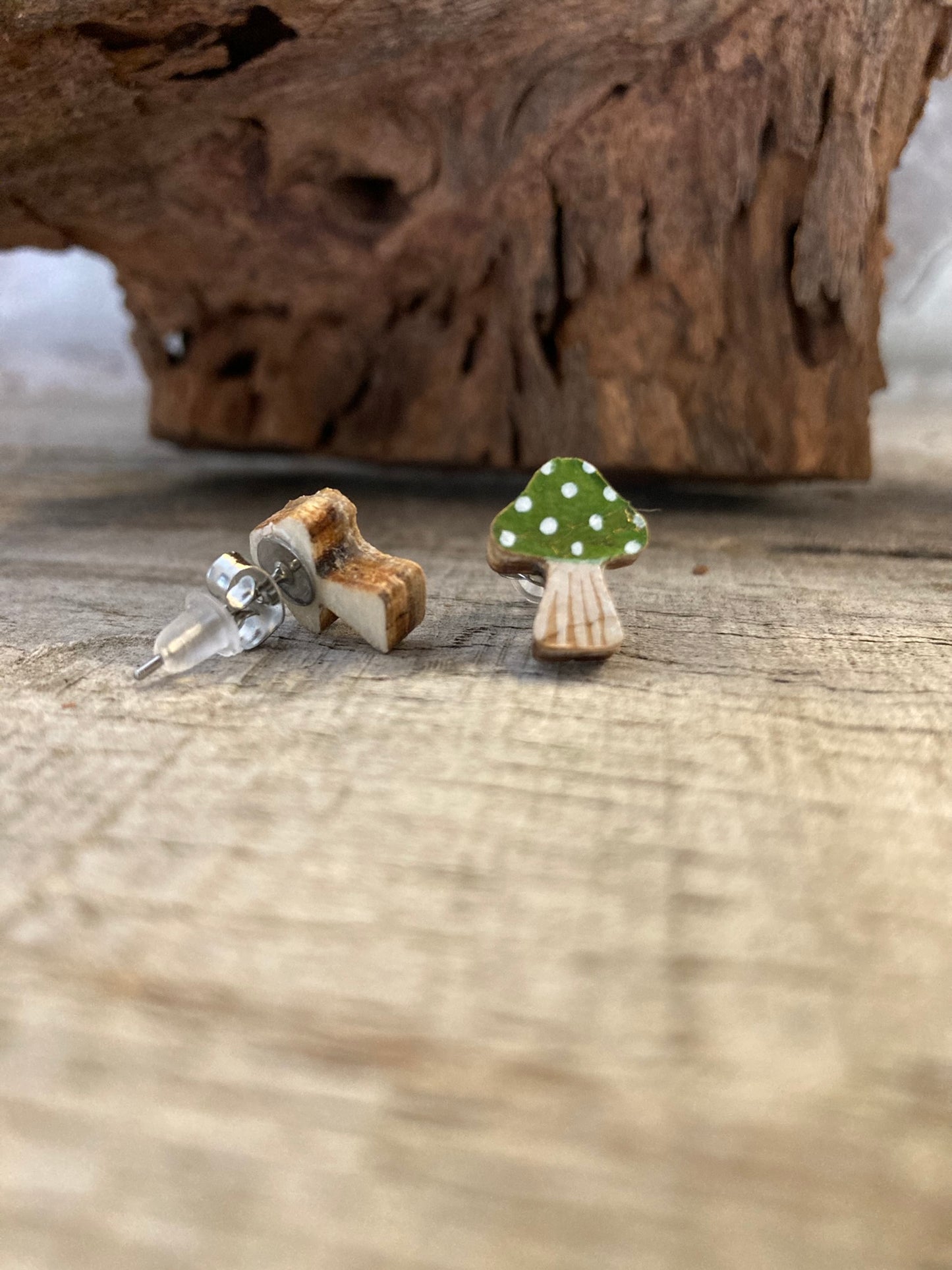 Green toadstool cork stud earrings showing front and FSC wood reverse with butterfly and silicone backs