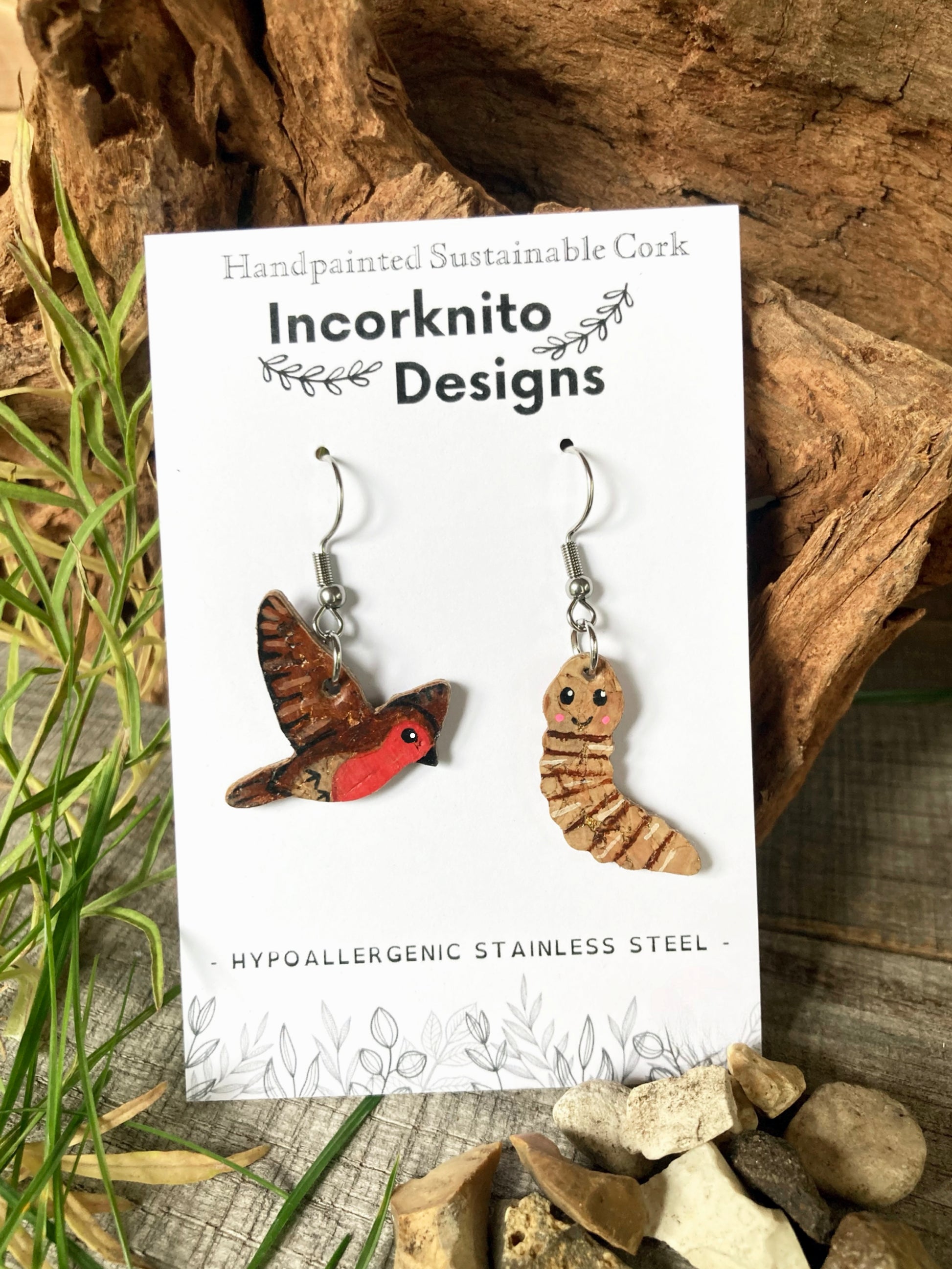 Incorknito Designs early bird catches the worm earrings on branded card with natural foliage