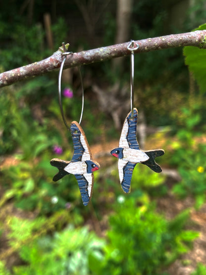 Handpainted swallow cork earrings on silver hoops, handmade in Suffolk UK — sustainable bird jewellery