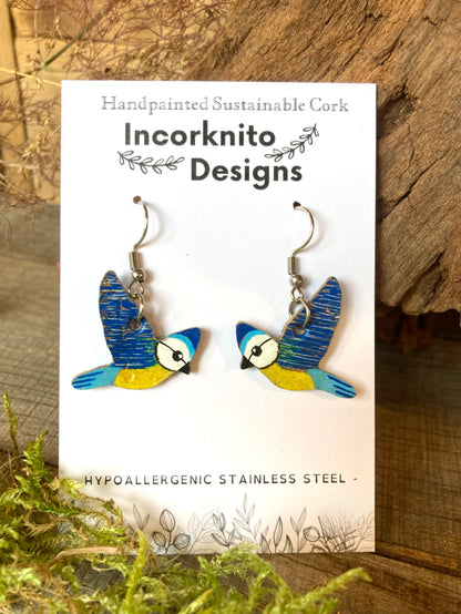Blue tit cork hook earrings on Incorknito Designs card with bark and moss