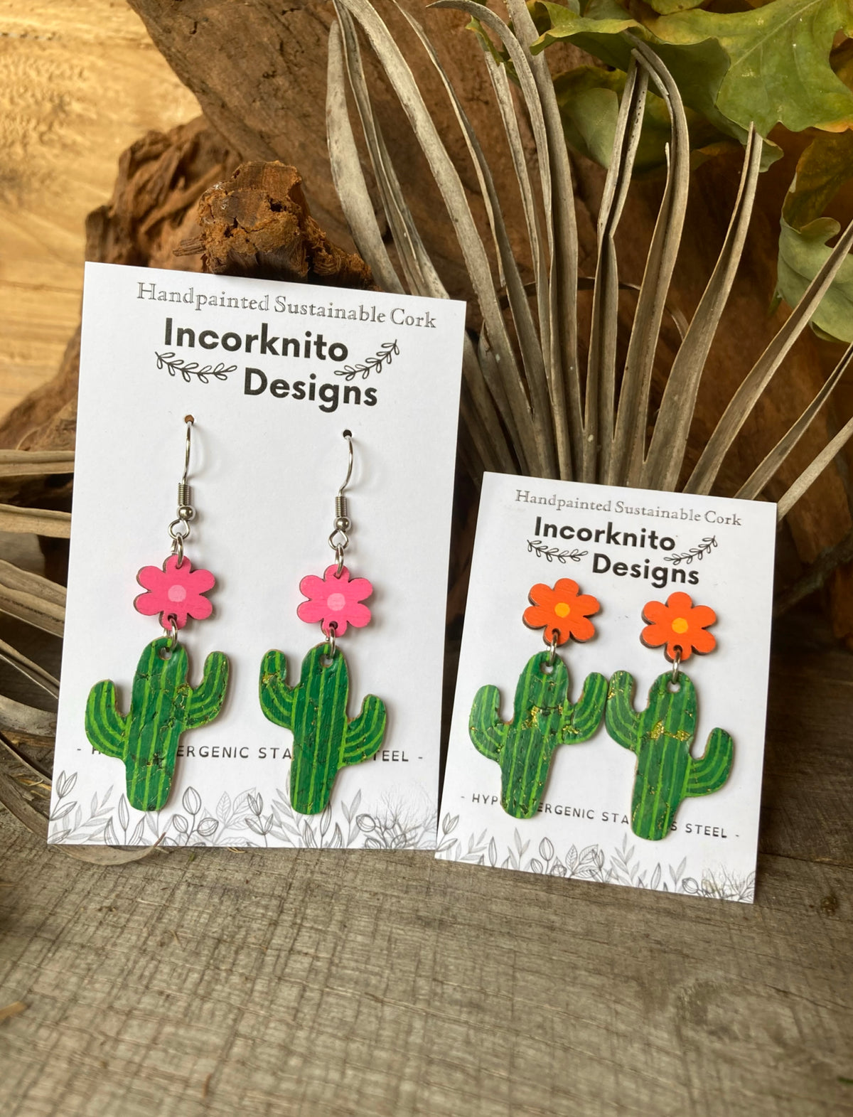 Cacti flower stud drop earrings in pink and orange on Incorknito Designs cards with a natural background