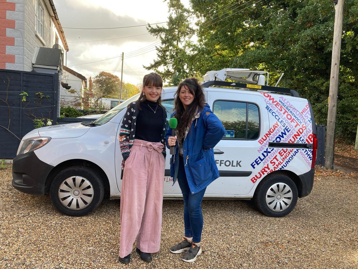 Kim Broadhurst, founder of Incorknito Designs, being interviewed by a BBC Suffolk reporter outside her Suffolk home, standing in front of a BBC Suffolk branded van.