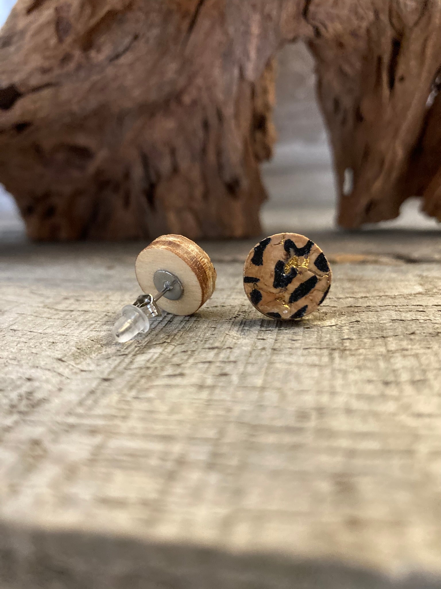 Leopard print cork stud earring showing front painted face and FSC wood reverse with stainless steel butterfly post