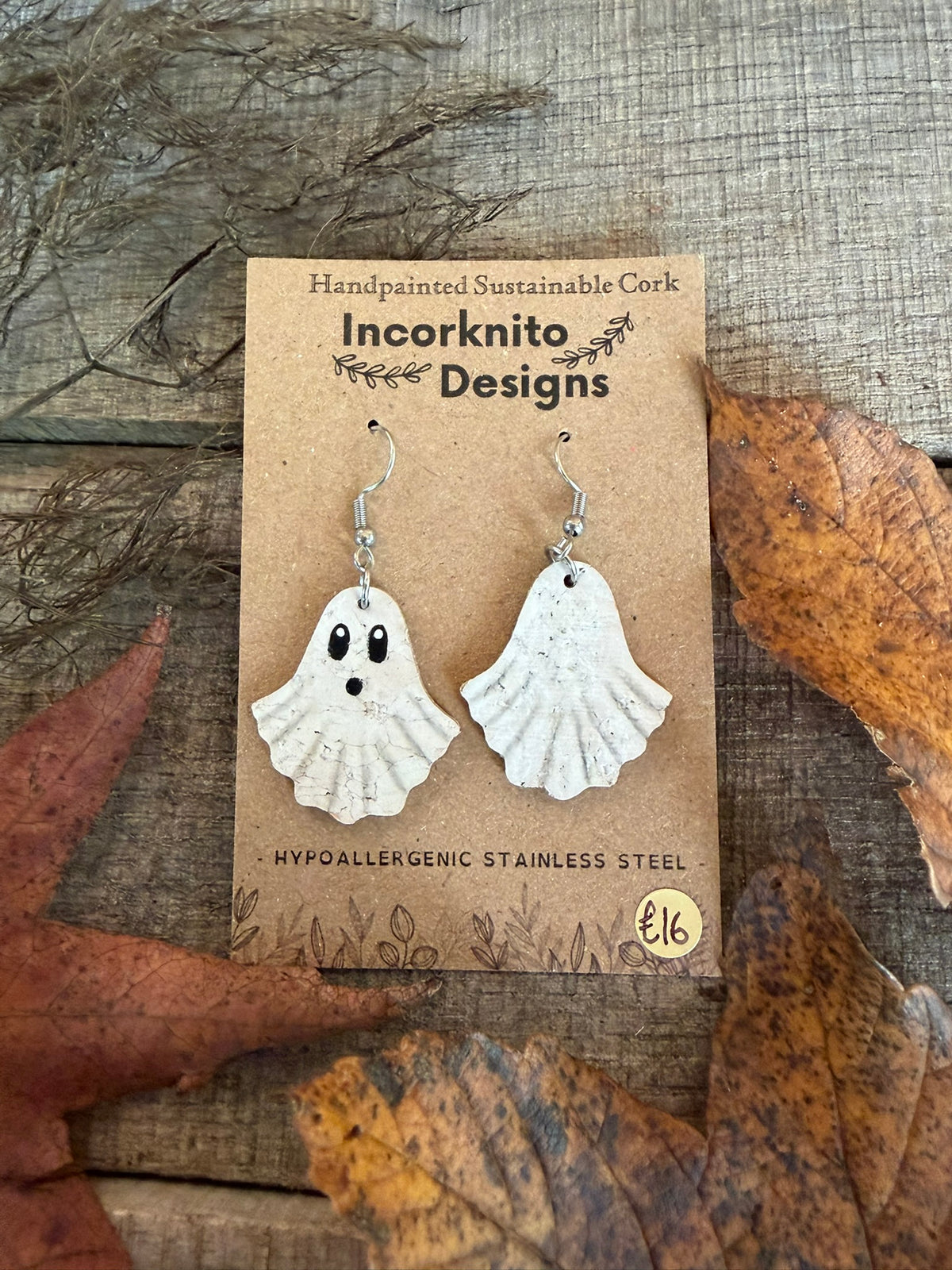 Front and reverse of Little Boo ghost earrings, showing the painted face and plain white back on silver-coloured hooks.