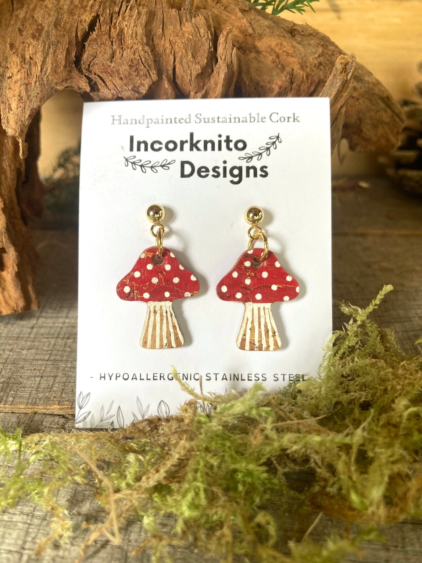 Red toadstool cork medium earrings on Incorknito Designs branded card — gold ball stud fastening, hypoallergenic stainless steel