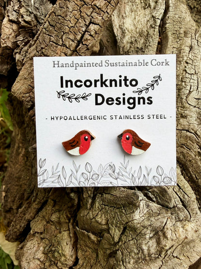 Robin cork stud earrings on an Incorknito Designs branded card against a bark background