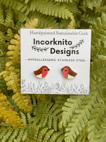 Robin cork stud earrings on an Incorknito Designs branded card against a green fern background