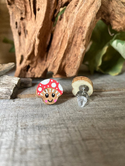 Smiley toadstool cork stud earring showing front painted face and FSC wood reverse with stainless steel butterfly post