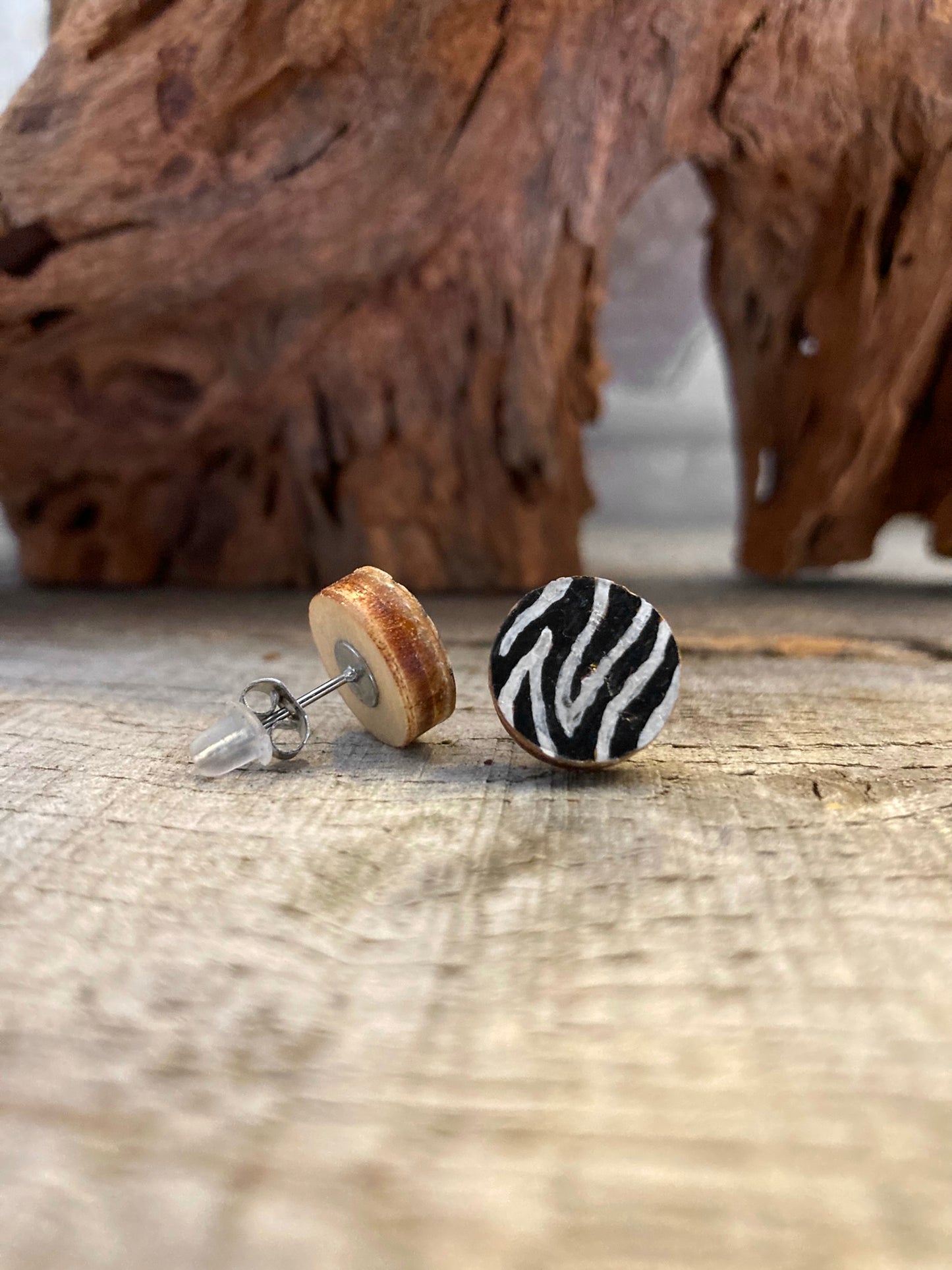 Zebra print cork stud earring showing front painted face and FSC wood reverse with stainless steel butterfly post